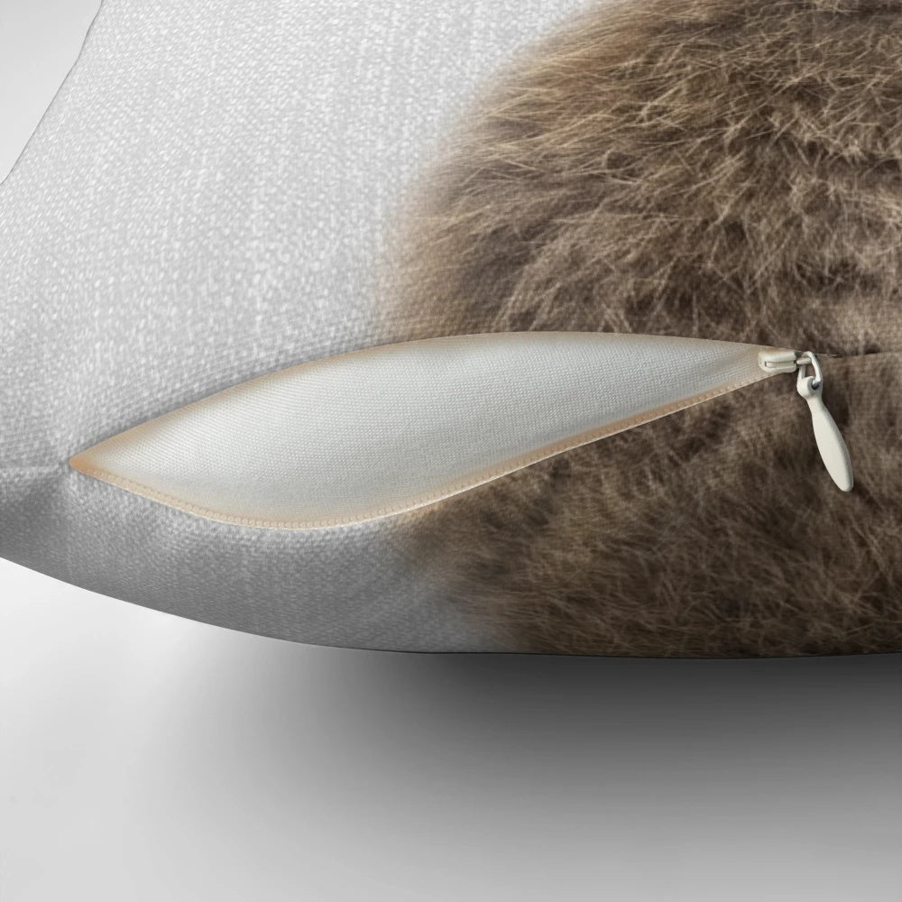 Colorful pillow featuring a rabbit or bunny illustration in a modern, minimalist style.