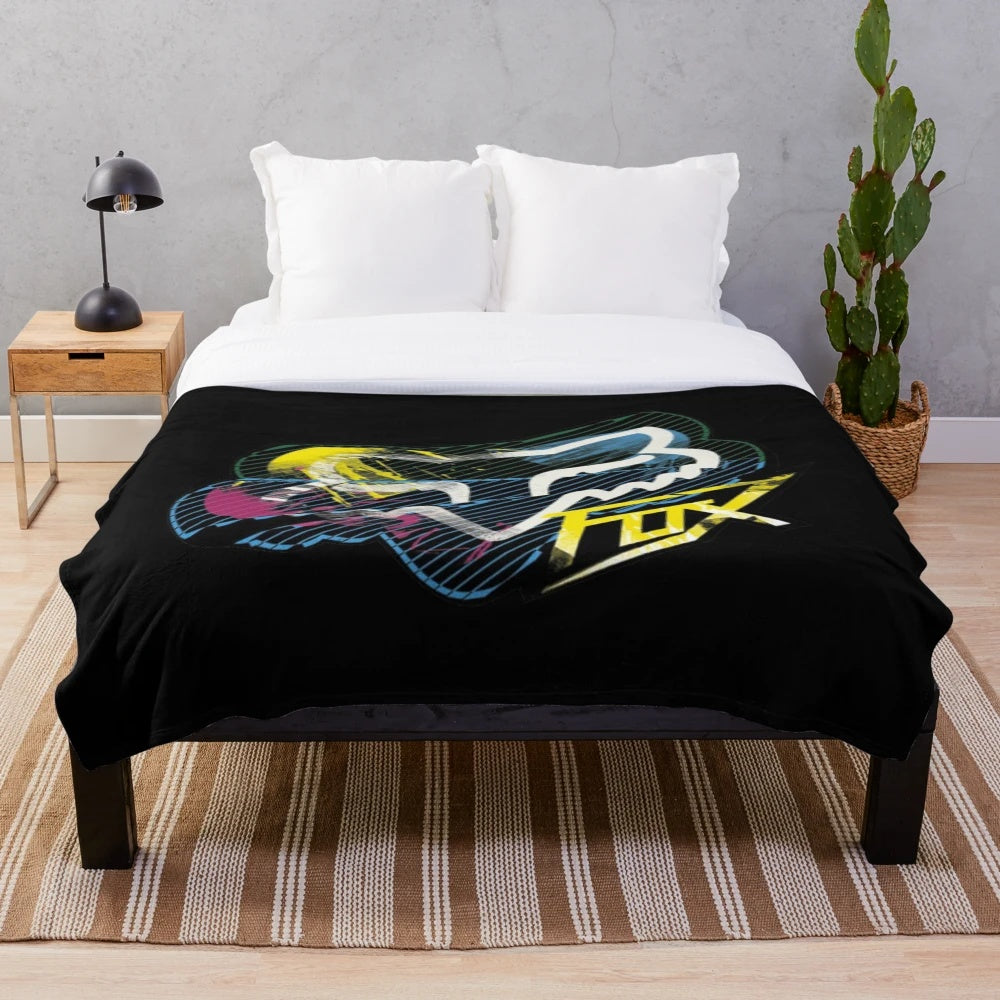 Colorful plush racing themed blanket with paint splatter design