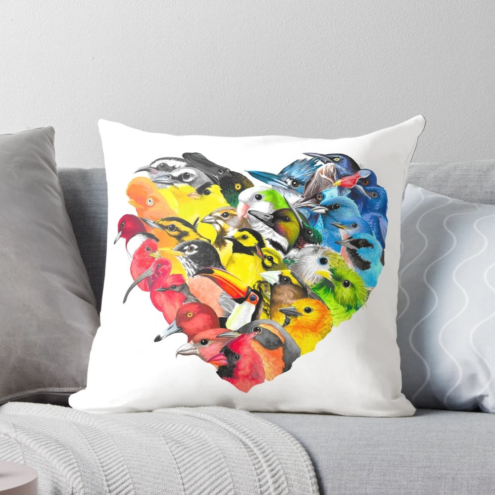 A vibrant, soft pillow featuring a heart-shaped bird design in a rainbow of colors, supporting the ACLU.