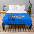 Vibrant rainbow-colored plush blanket with abstract paint splatter design