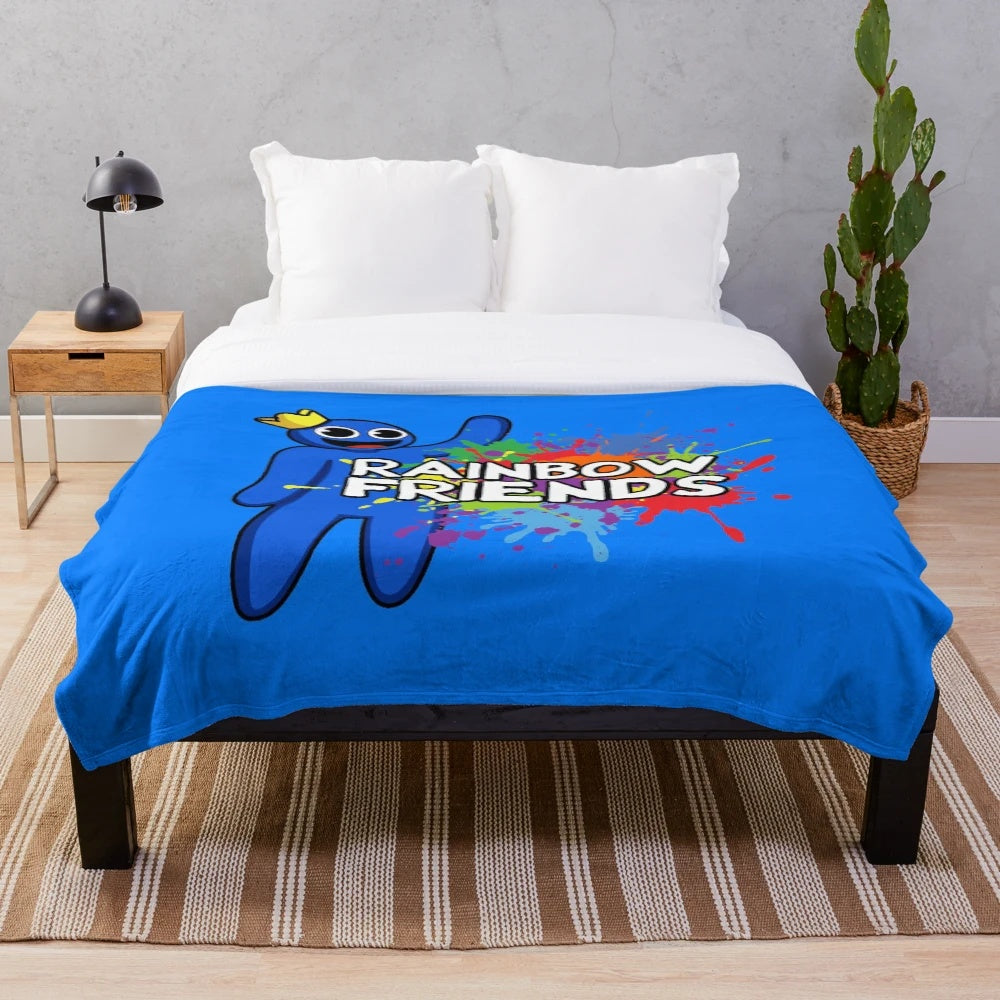 Vibrant rainbow-colored plush blanket with abstract paint splatter design