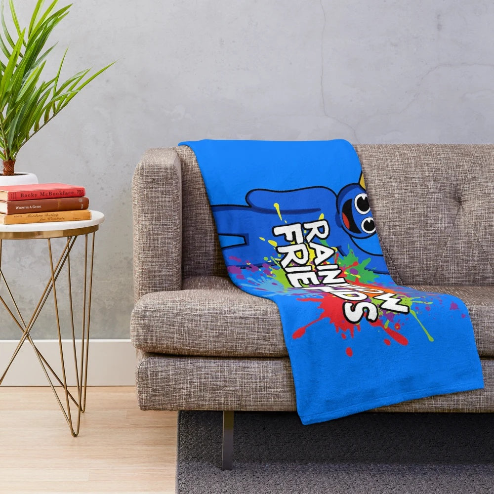 Vibrant rainbow-colored plush blanket with abstract paint splatter design