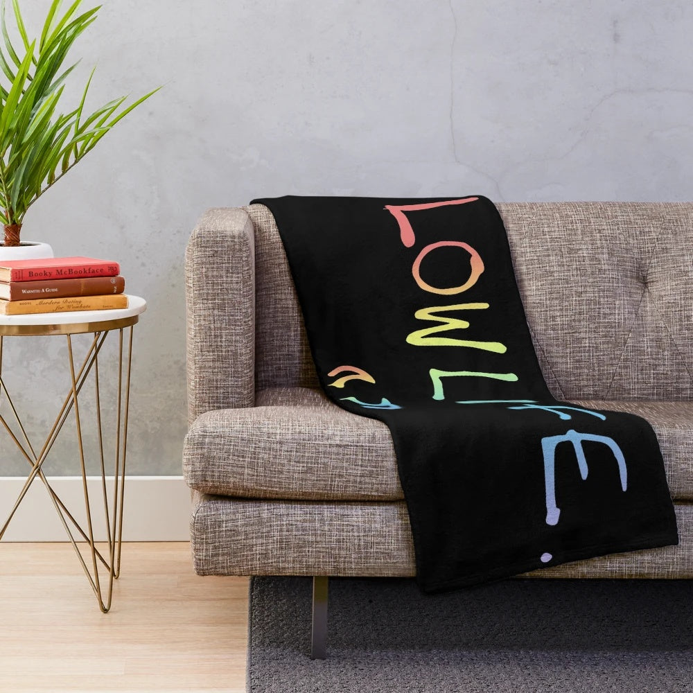 Colorful rainbow pride plush blanket with LGBTQ+ inspired design
