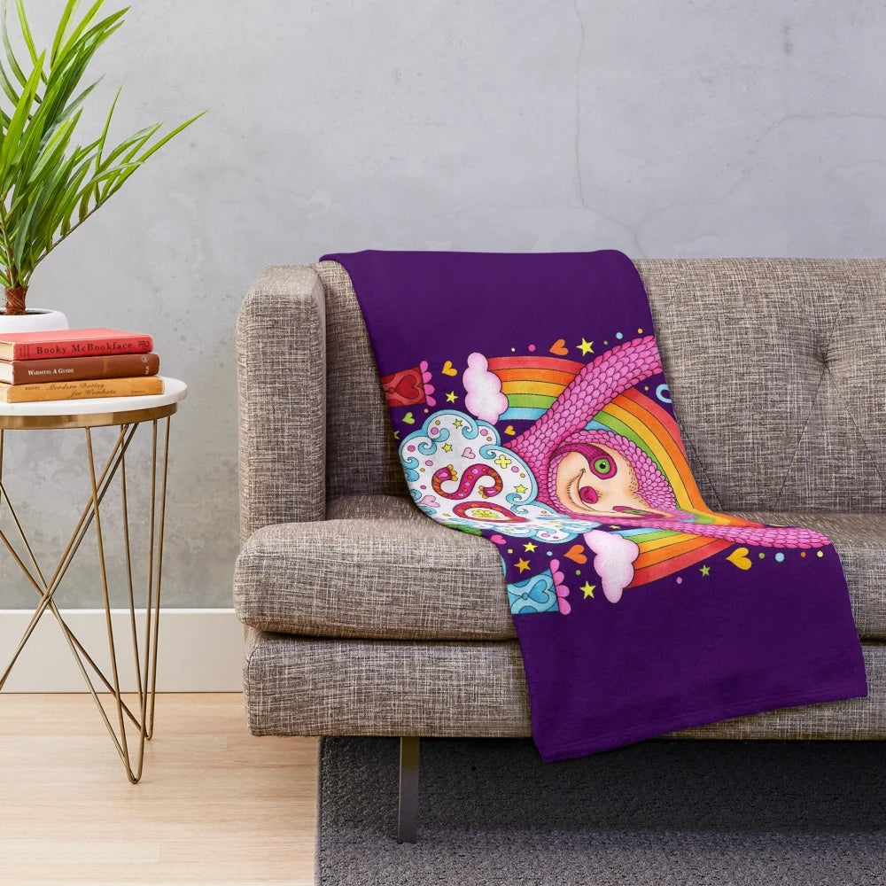 Colorful rainbow sloth plush blanket with a happy, smiling sloth design