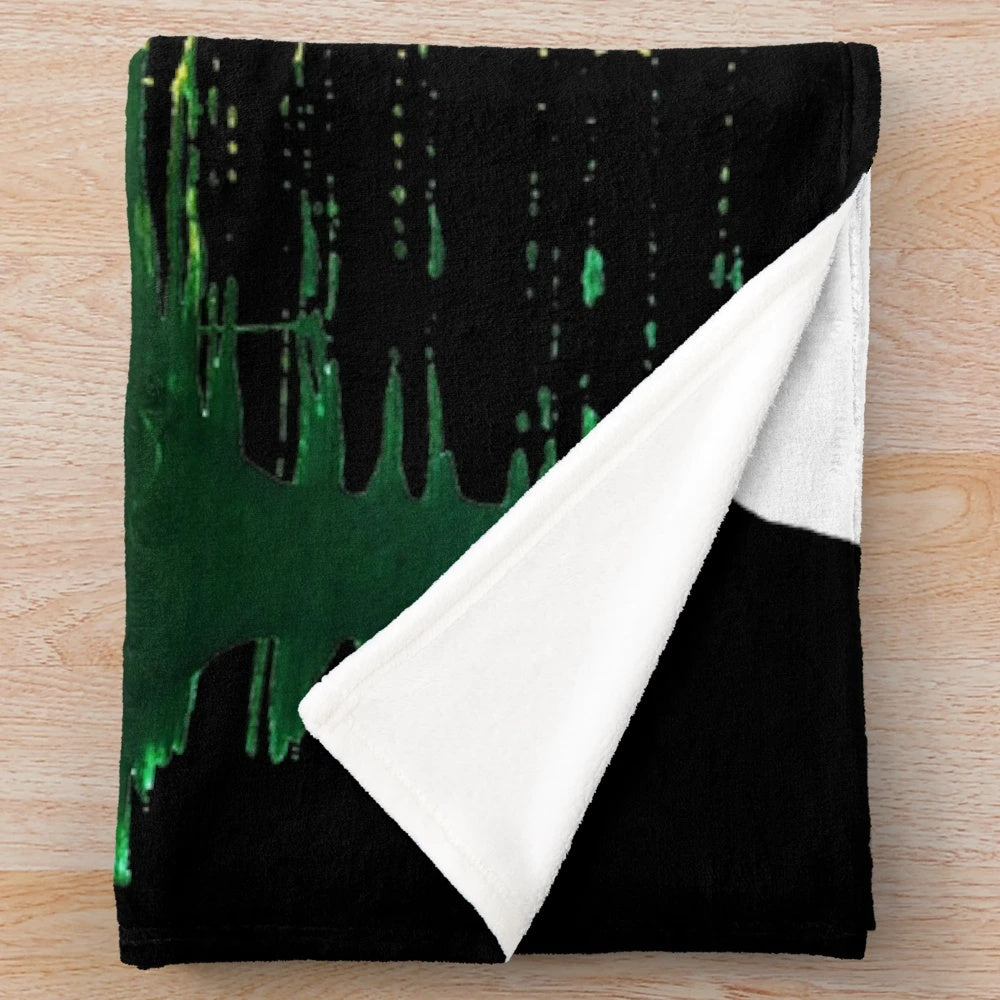 Plush blanket featuring three little birds in rasta colors of red, green, and gold