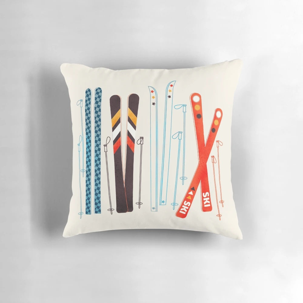 Colorful retro ski illustration printed on a plush pillow, creating a cozy and festive mountain-inspired accent.