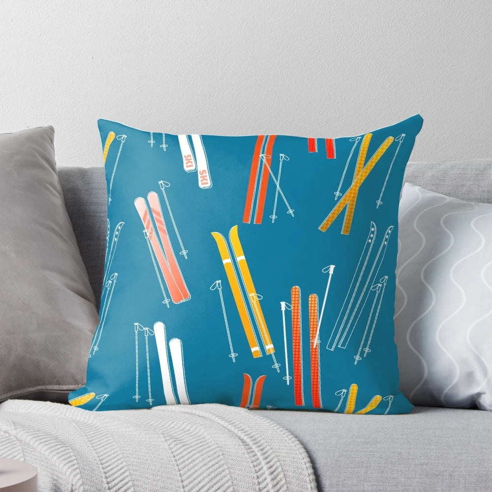Colorful, retro ski pattern printed on a dark blue pillow
