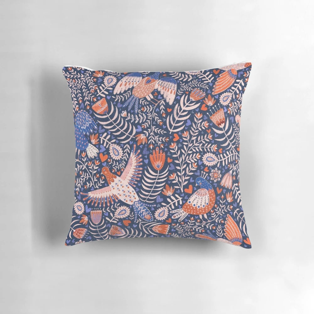 A throw pillow featuring a vibrant, patterned design of Swedish folk art birds against a dark blue background.