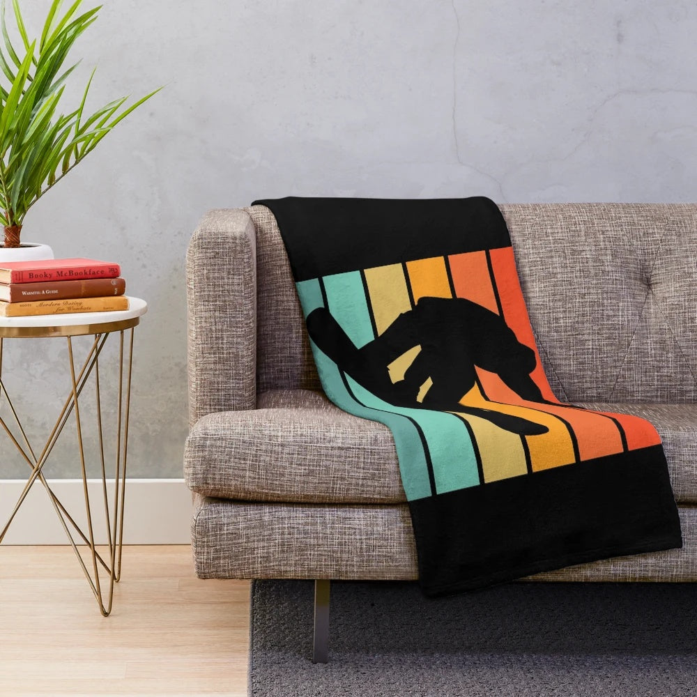 Colorful plush blanket featuring a snowboarding silhouette design