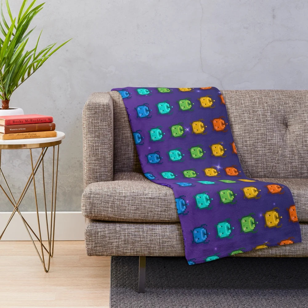 Stardew Valley Junimos Plush Blanket featuring a vibrant rainbow pattern