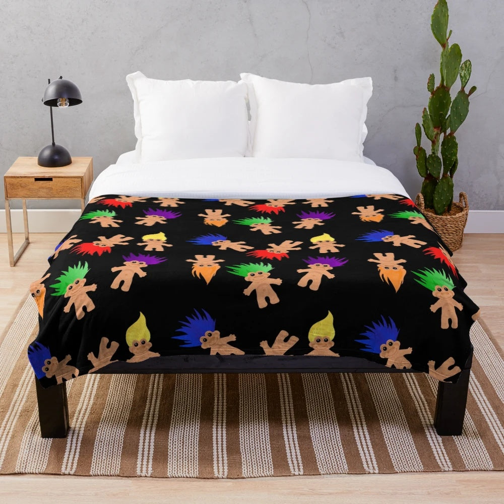 Colorful plush blanket with troll dolls pattern