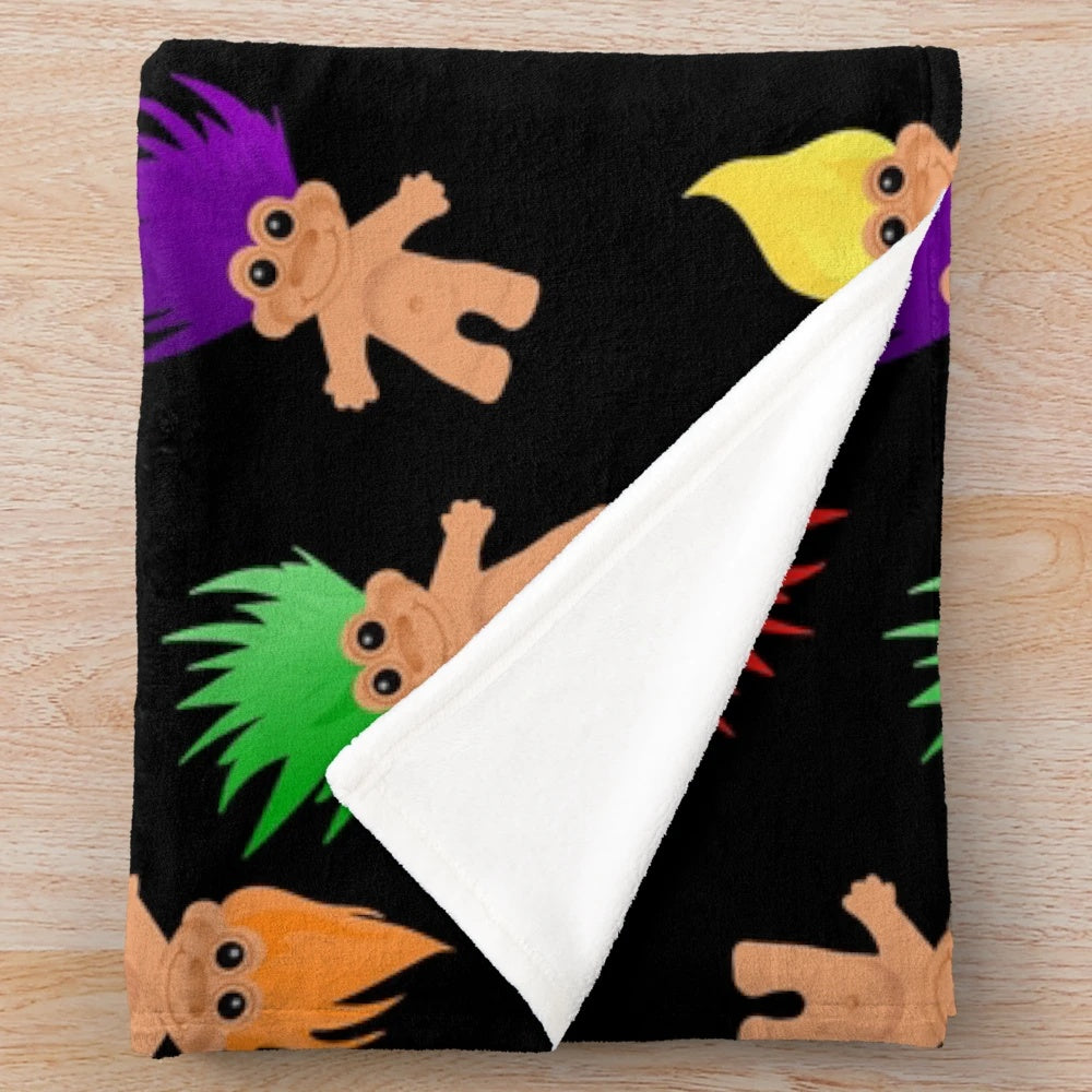 Colorful plush blanket with troll dolls pattern