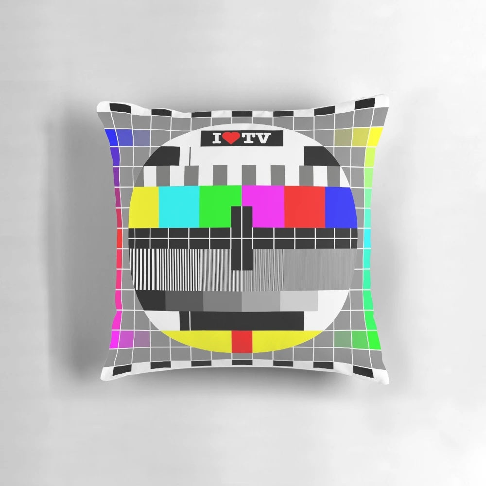 Vibrant TV-themed pillow with an analog television design