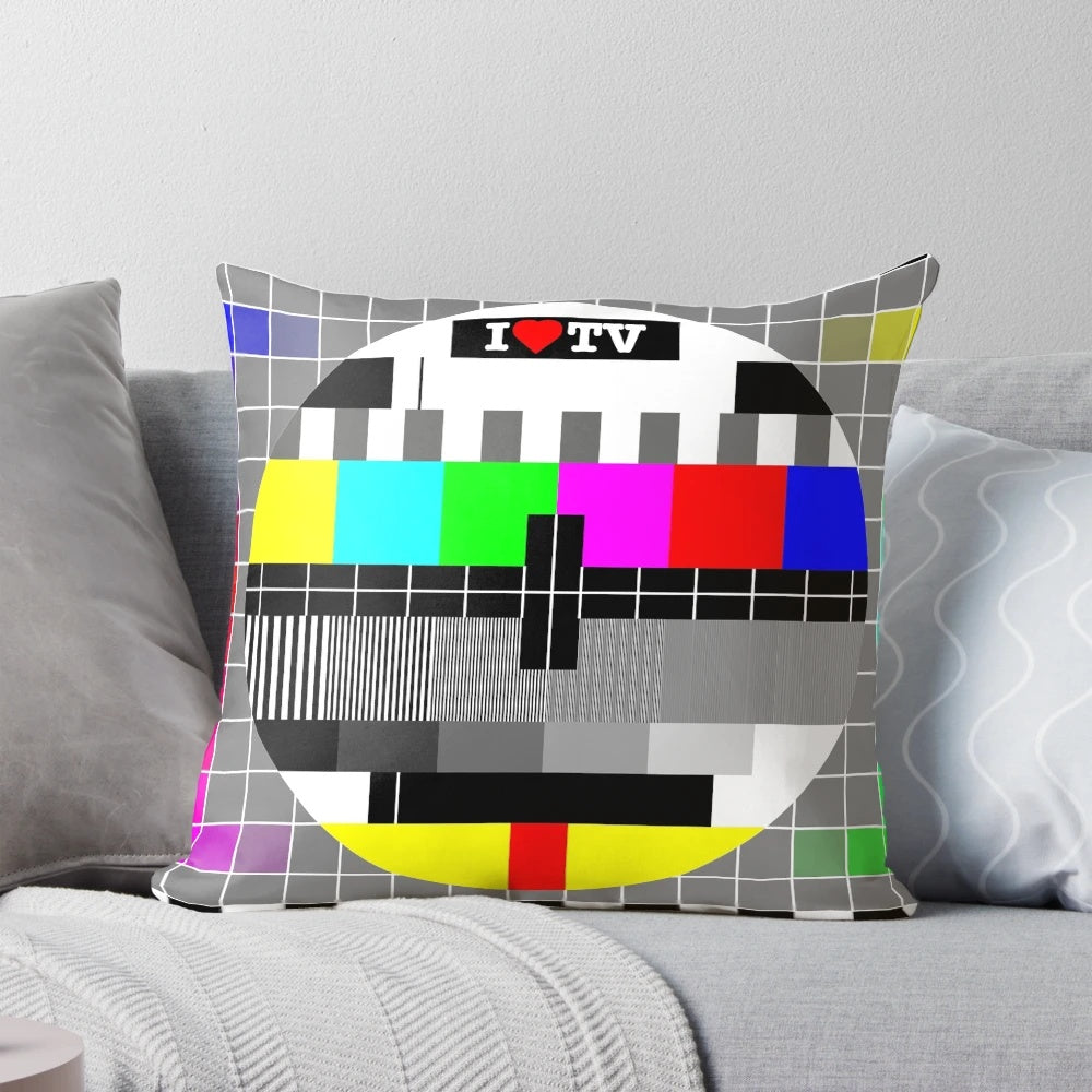 Vibrant TV-themed pillow with an analog television design