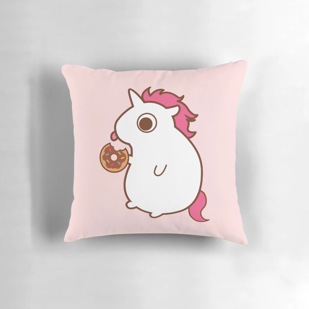 Vibrant throw pillow featuring a colorful unicorn design with candy, sweets, and pastry elements.
