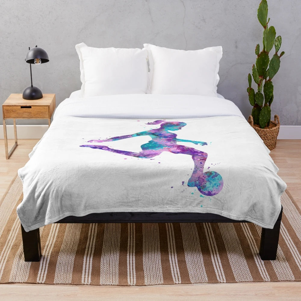 Colorful watercolor design of a girl soccer player on a plush blanket