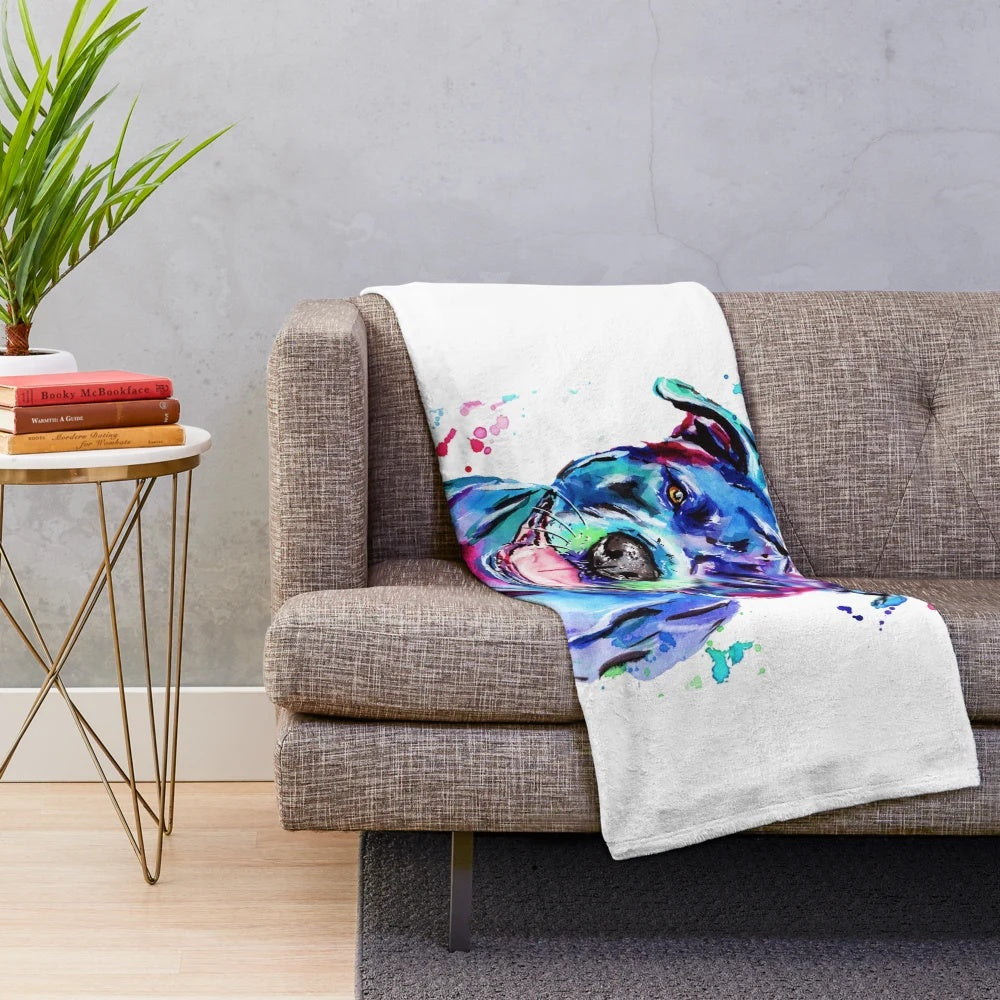 Vibrant watercolor painting of a Staffordshire Terrier dog on a soft, plush blanket