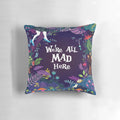 Colorful throw pillow featuring the quote "We're All Mad Here" from Alice in Wonderland