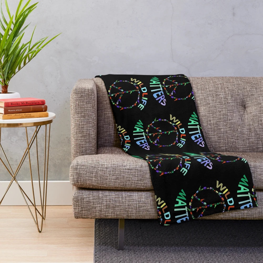 Colorful plush blanket with wildlife animals in a peace sign design