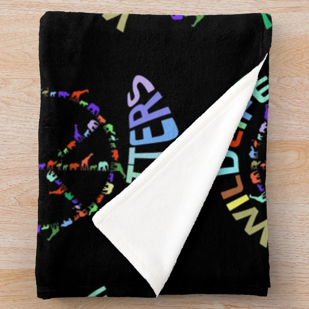 Colorful plush blanket with wildlife animals in a peace sign design