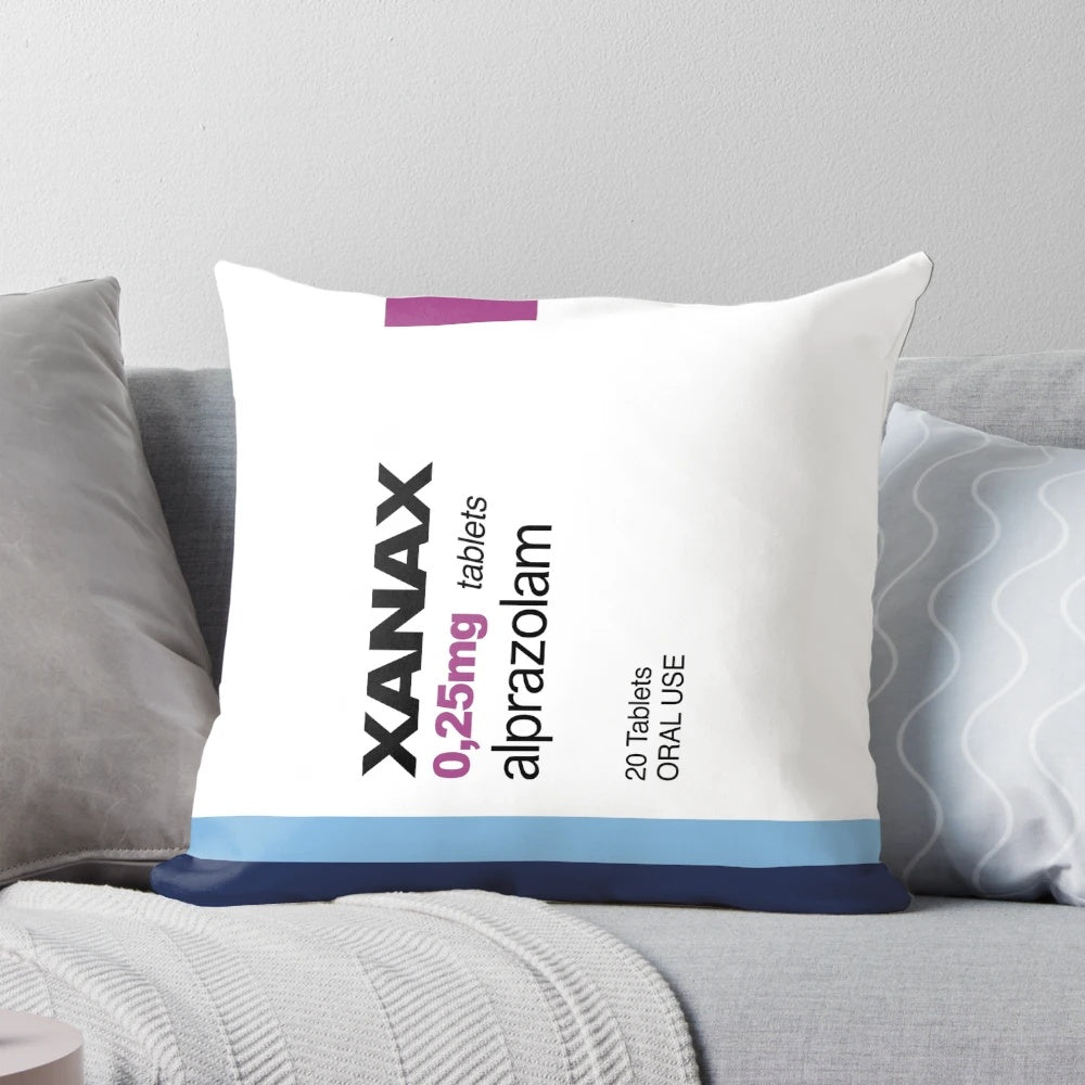 Colorful, retro-style pillow with Xanax-inspired design and rainbow colors
