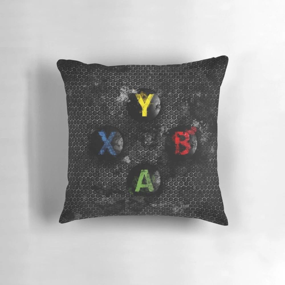 Vibrant splatter painting-style pillow featuring the iconic Xbox controller buttons