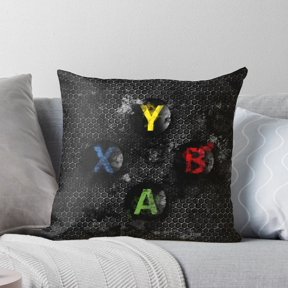 Vibrant splatter painting-style pillow featuring the iconic Xbox controller buttons