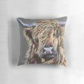 Colourful highland cow printed on a plush decorative pillow with a soft, cozy texture.