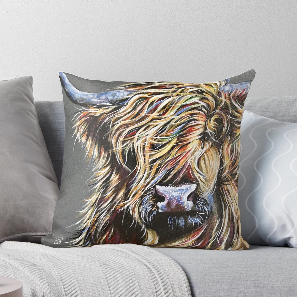 Colourful highland cow printed on a plush decorative pillow with a soft, cozy texture.