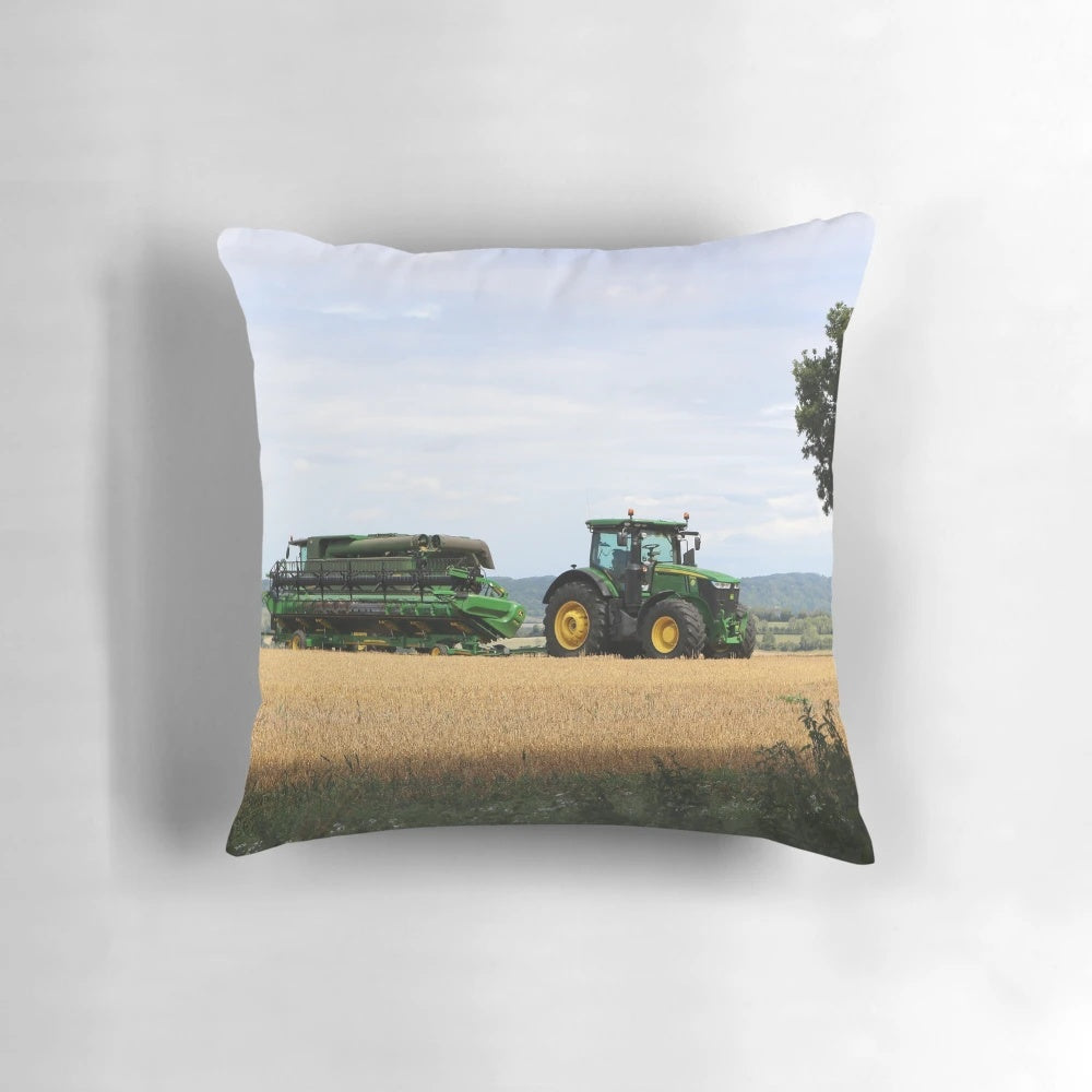 A soft, plush pillow featuring a combine harvester and tractor design, perfect for adding a rustic, farmhouse touch to any space.
