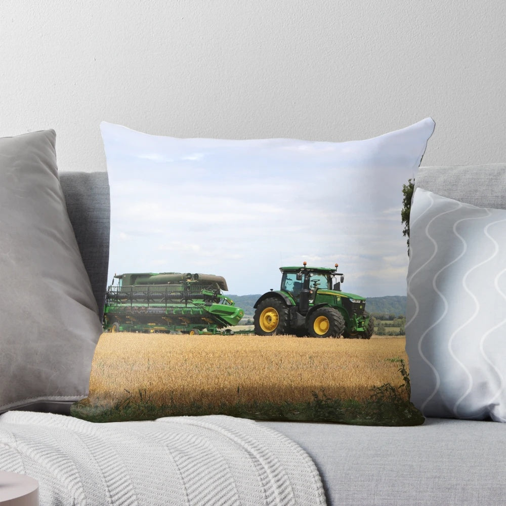 A soft, plush pillow featuring a combine harvester and tractor design, perfect for adding a rustic, farmhouse touch to any space.