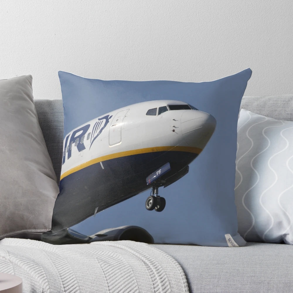 A soft, plush pillow depicting a Ryanair Boeing 737 aircraft at Schiphol Airport.