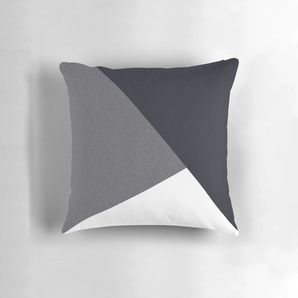 A grey geometric triangle-patterned pillow, perfect for yoga, fitness, or home decor.