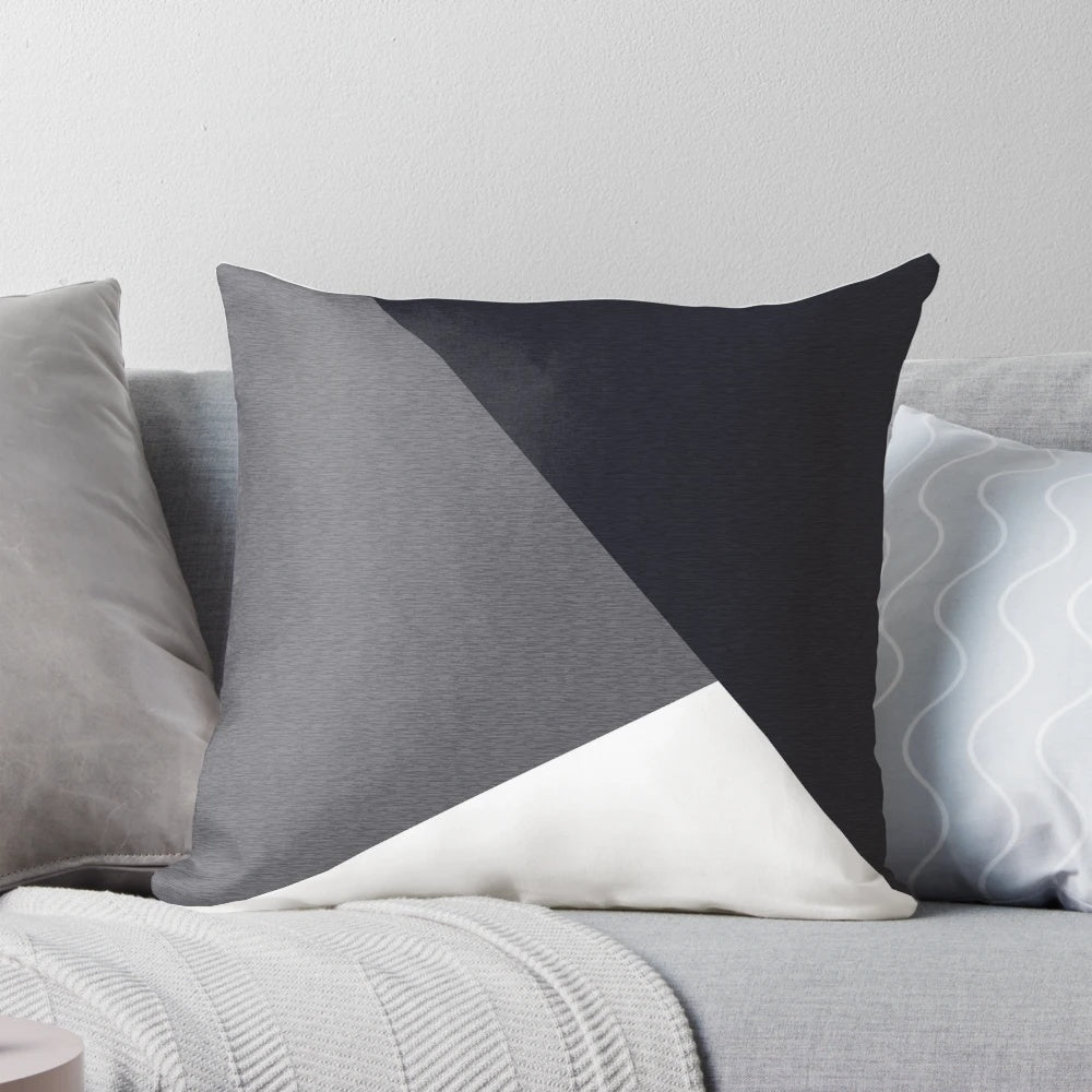 A grey geometric triangle-patterned pillow, perfect for yoga, fitness, or home decor.