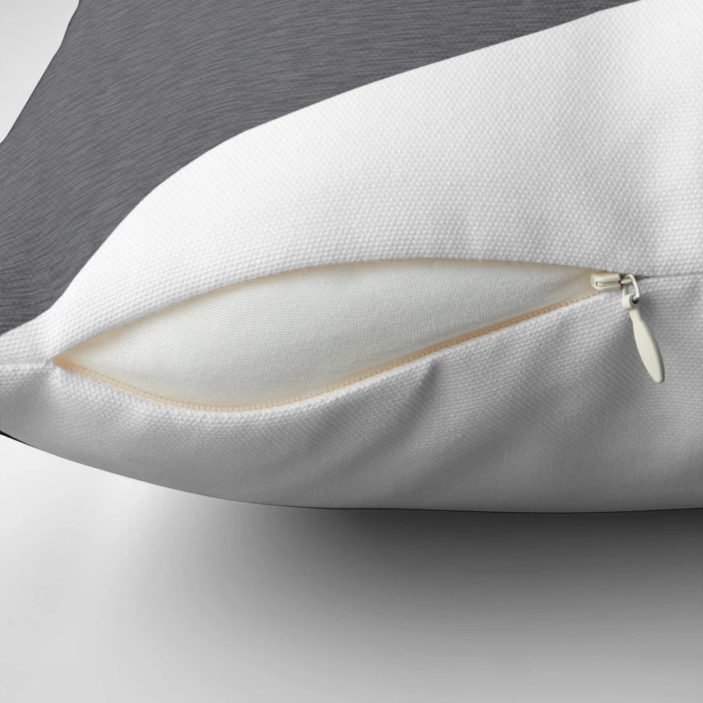 A grey geometric triangle-patterned pillow, perfect for yoga, fitness, or home decor.