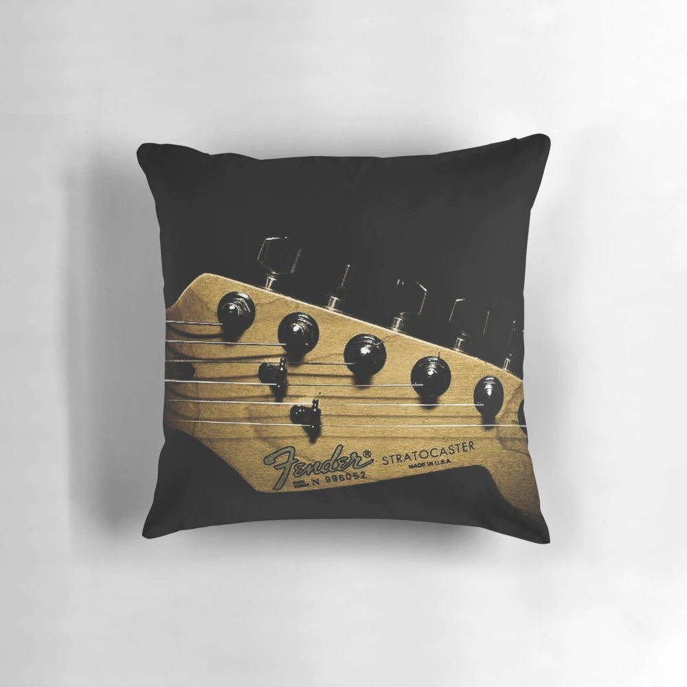 Soft, plush pillow featuring an electric guitar design, perfect for music lovers.