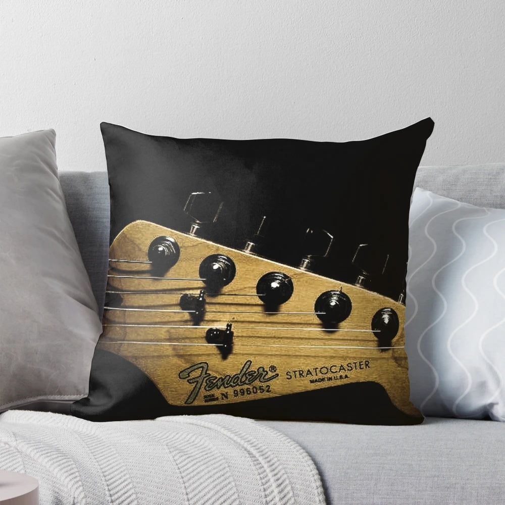 Soft, plush pillow featuring an electric guitar design, perfect for music lovers.