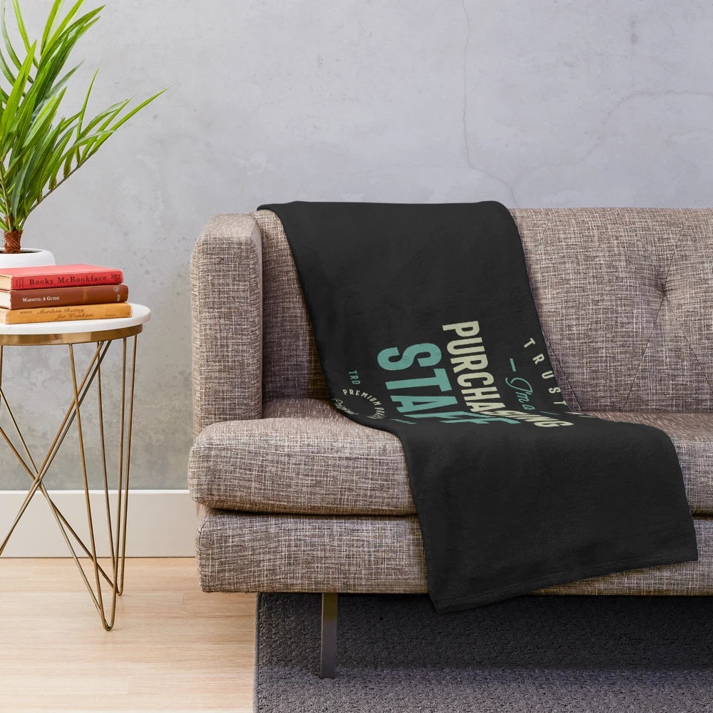 A cozy plush blanket for purchasing staff to stay warm at the office