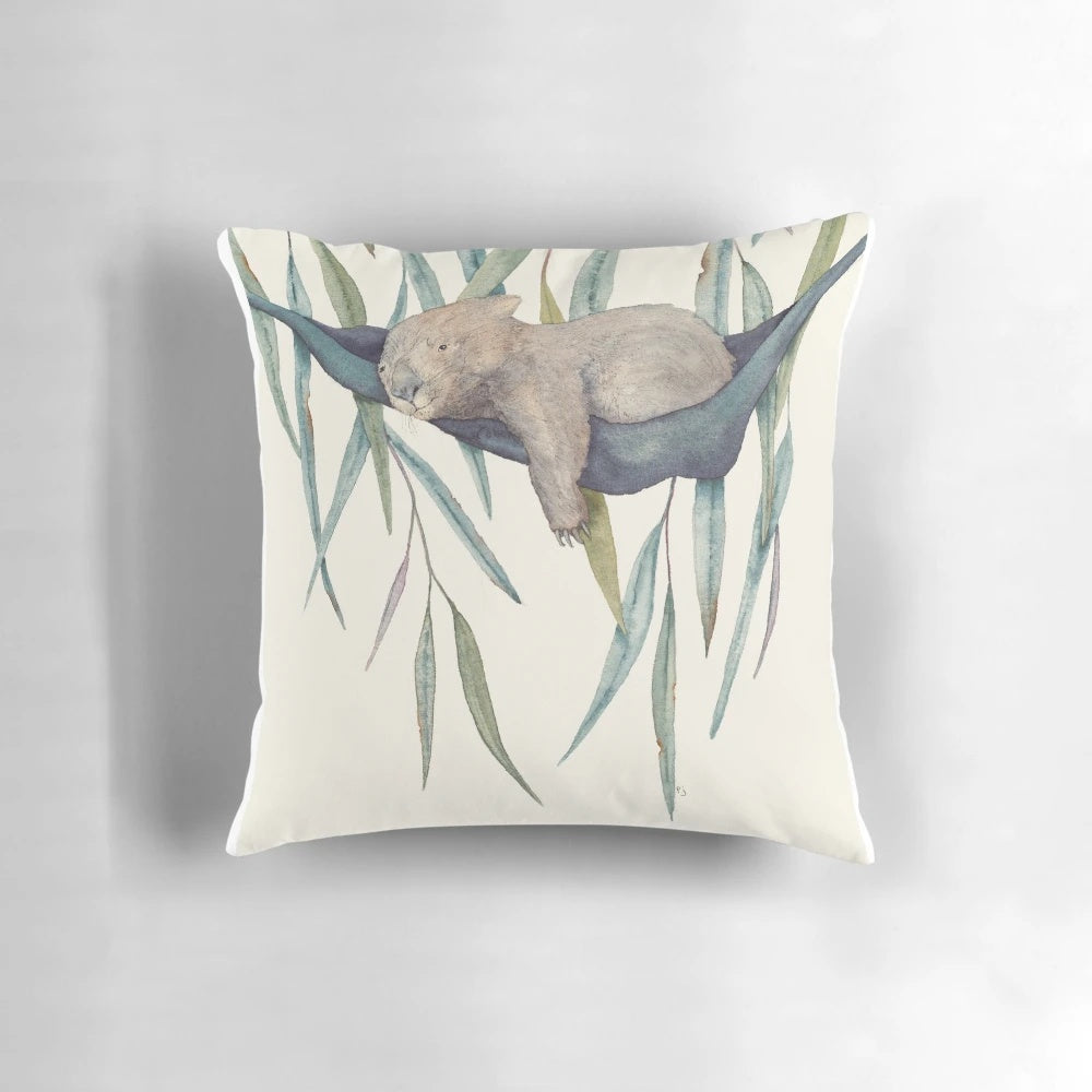 A cozy and comfortable pillow featuring a cute wombat design, perfect for afternoon naps or relaxation.