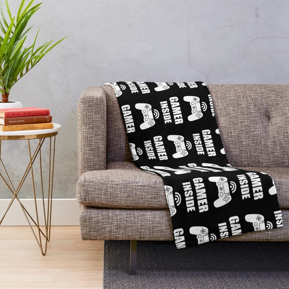 Cozy gaming blanket featuring a gamer design