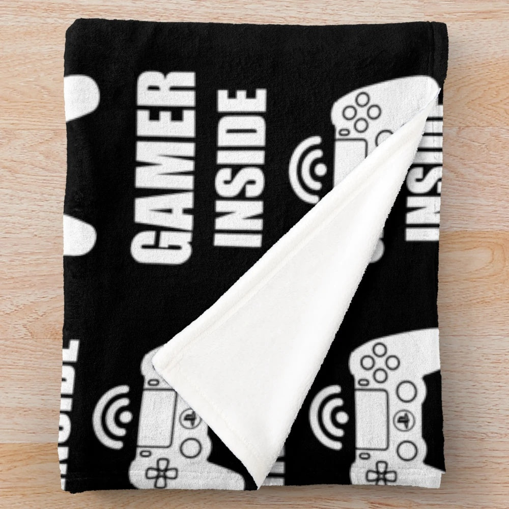 Cozy gaming blanket featuring a gamer design