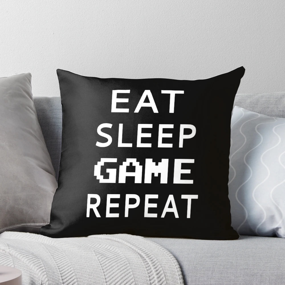 Soft, plush pillow with the text "Eat Sleep Game Repeat" for video game enthusiasts