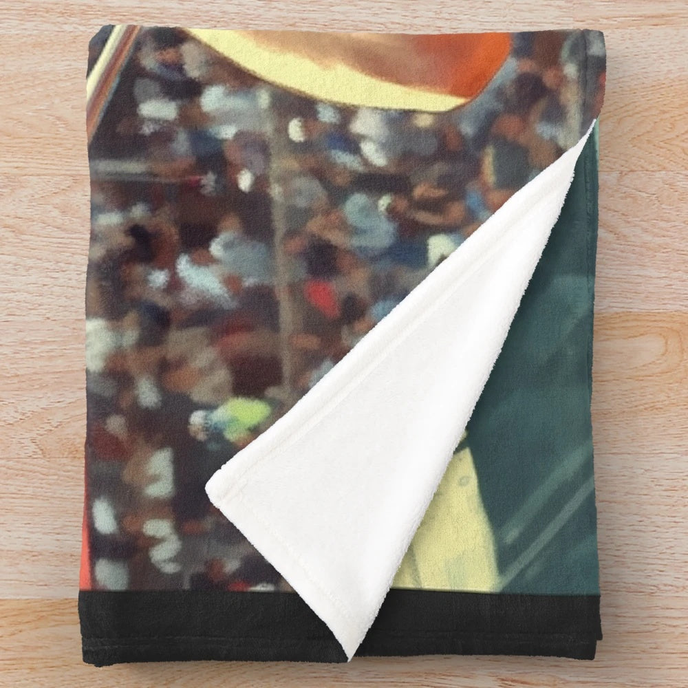 Plush blanket featuring a humorous pole vault mishap illustration