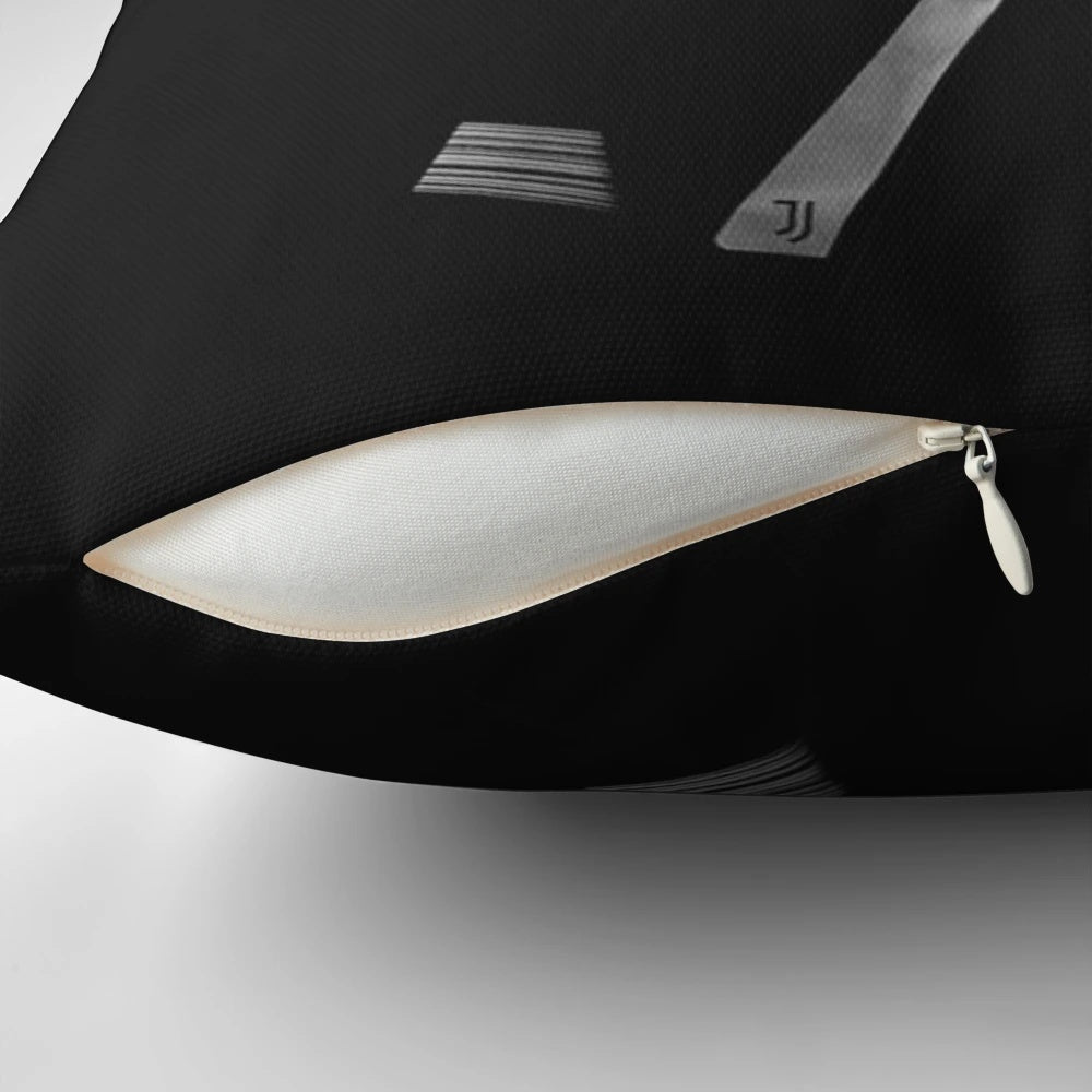 A black and white pillow featuring the iconic image of Cristiano Ronaldo, the celebrated football/soccer player.