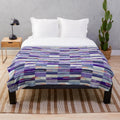 Plush blanket featuring the iconic Elizabeth Line underground moquette pattern