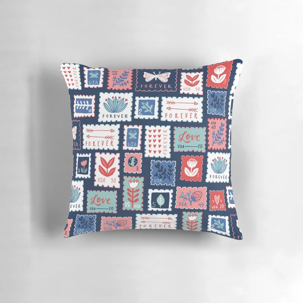 A plush, decorative pillow featuring the iconic USPS Forever Stamps design.