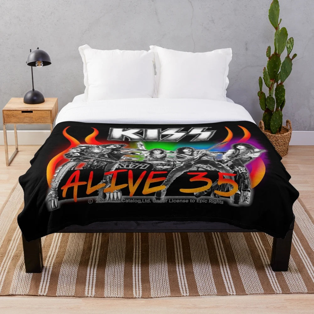 Kiss band members on a plush blanket for 35th anniversary world tour
