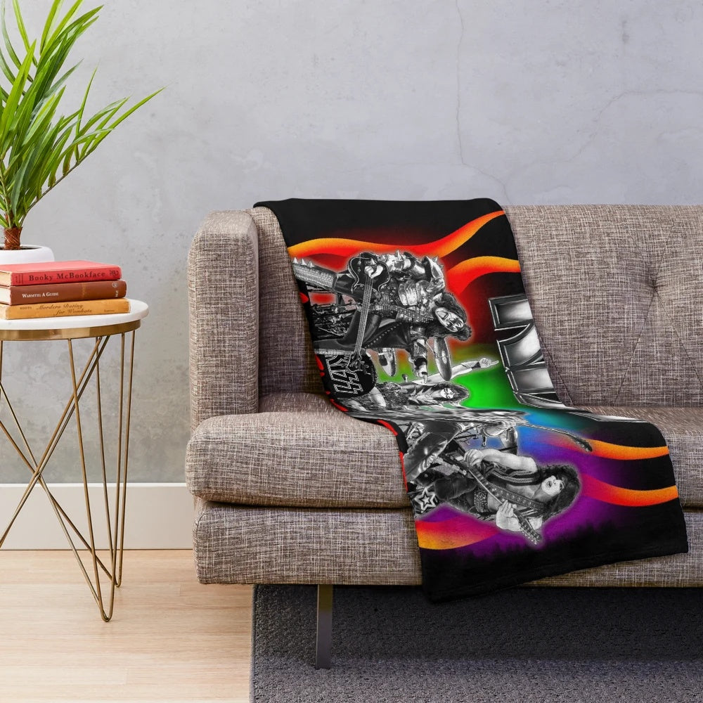 Kiss band members on a plush blanket for 35th anniversary world tour