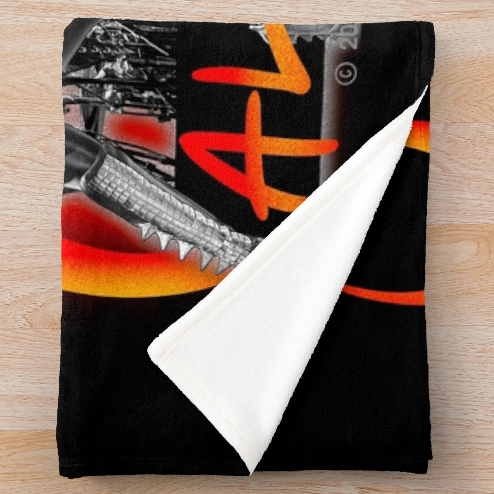 Kiss band members on a plush blanket for 35th anniversary world tour
