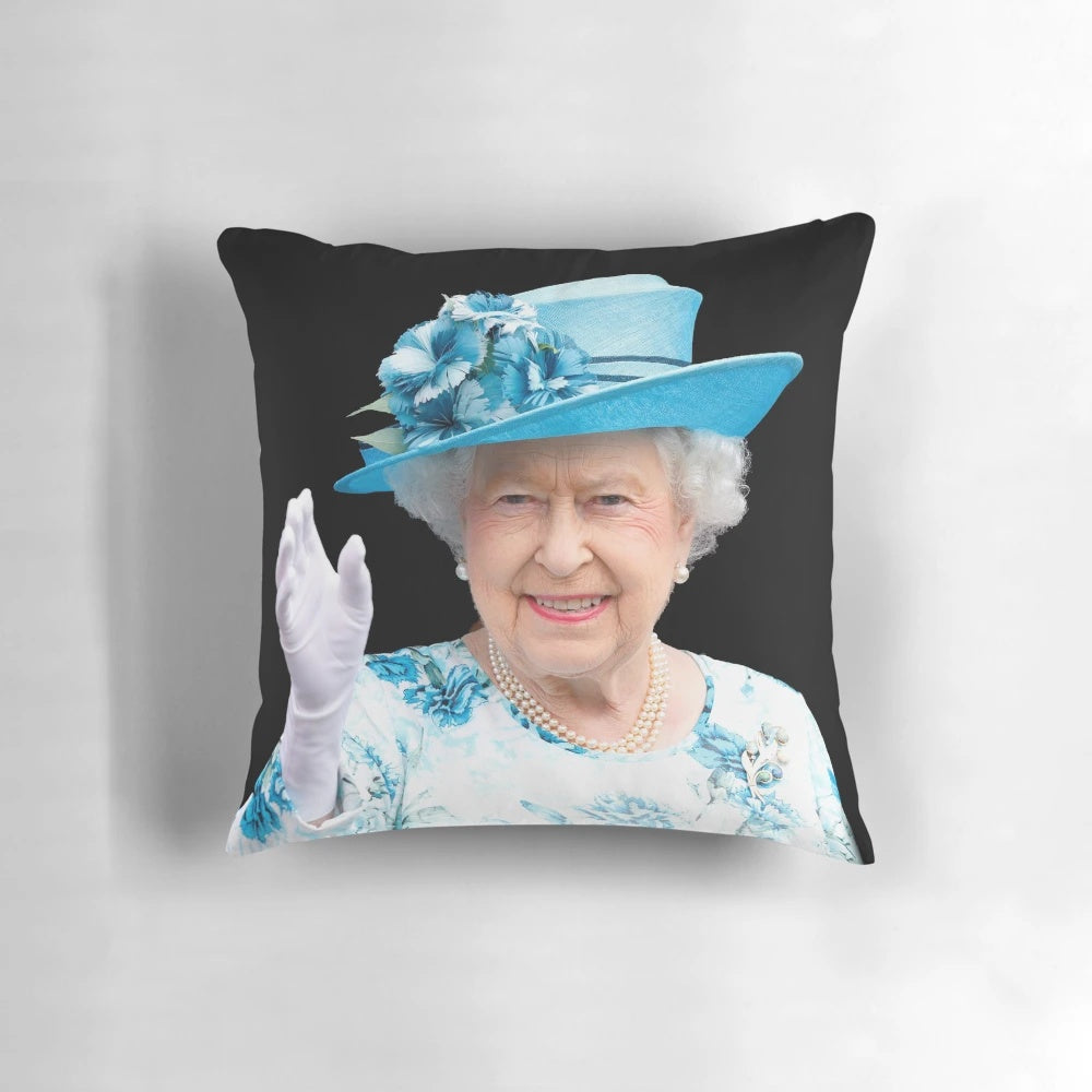 A decorative pillow featuring a portrait of Queen Elizabeth II.